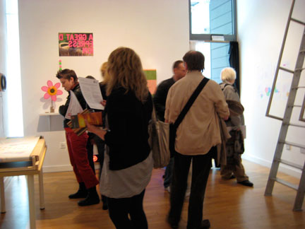 Visitors look at my work in the residency studio/gallery.