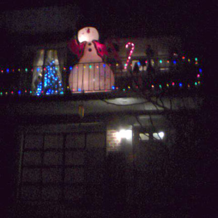 Pre-blizzard: Inflatable snowman on a balcony.