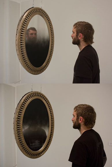 mirrorsblackportrait, 2011, mirrors, paint, frames, wire, motor, hardware; 112 x 21 x 21 in / 2.8 m x 0.5 x 0.5 m (site variable).