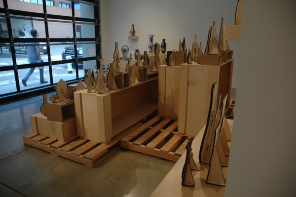 Stephanie is super meticulous about the presentation of her work. I love the open backs of these crates and the industrial feel of the lasercut stands. The blurred out postcards are especially wily.