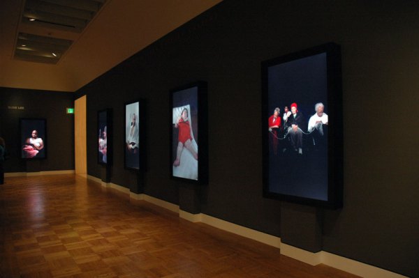 Hall of video portraits. Susie Lee. Portland Art Museum.