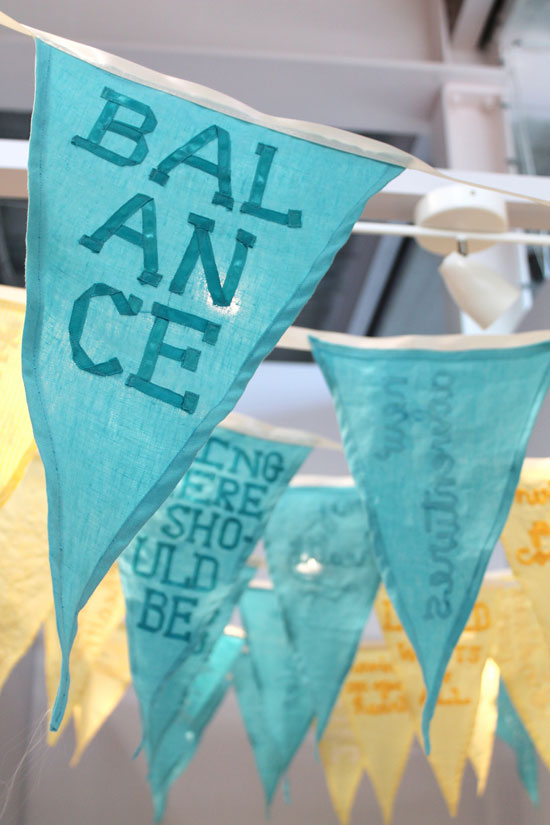 Give Thanks, 2011, site-specific installation of 39 pennant flags: satin ribbon, linen, gratitude statements, dimensions site-variable. Recently on view at Untitled Gallery @ Project Space Leeds, Leeds, UK.