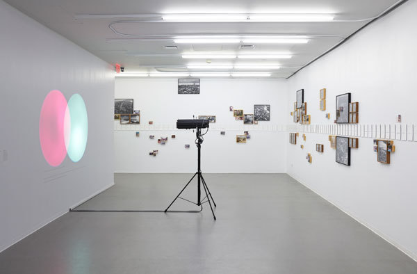 Installation view of the Ungovernables at the New Museum, NY. Foreground/left: Amalia Pica, Venn diagrams (under the spotlight). 2011 Installation with spotlights, motion sensors and text. // Source: NewMuseum.org.