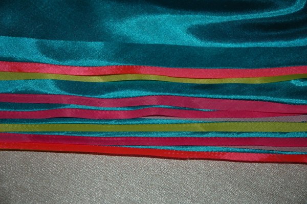 Parts of a flag-to-be; wrapped seams readied for pressing.