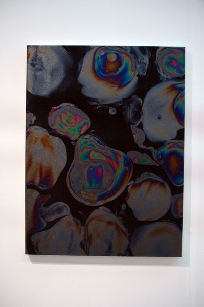 Everybody loves these iridescent rainbows that show up on oil slicks; they're the perfect metaphor for finding beauty in the everyday. Frank Ammeriaan has found a way to recreate the effect using "chemicals on canvas." Touché. Frank Ammeriaan, Upstream Gallery, Amsterdam.