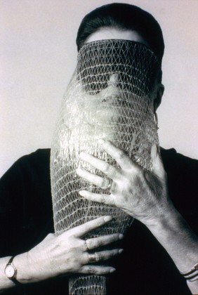 Lygia Clark wearing Máscara abismo com tapa-olhos (Abyssal mask with eye-patch, 1968), a work made of fabric, elastic bands, a nylon bag, and a stone, in use. Courtesy Associação Cultural "O Mundo de Lygia Clark," Rio de Janeiro. Photograph: Sergio Gerardo Zalis, 1986 // Source: moma.org.