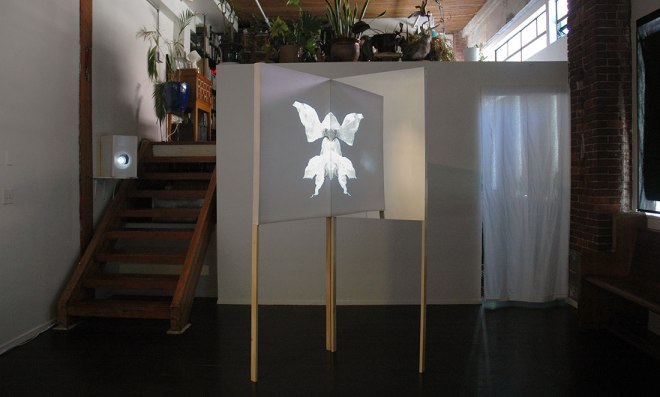 Christine Wong Yap, Projection, 2014, video installation: video, wood, fabric, acrylic, 80 x 32 x 32.125 inches. Installation view at Portland ‘Pataphysical Society, Portland, OR