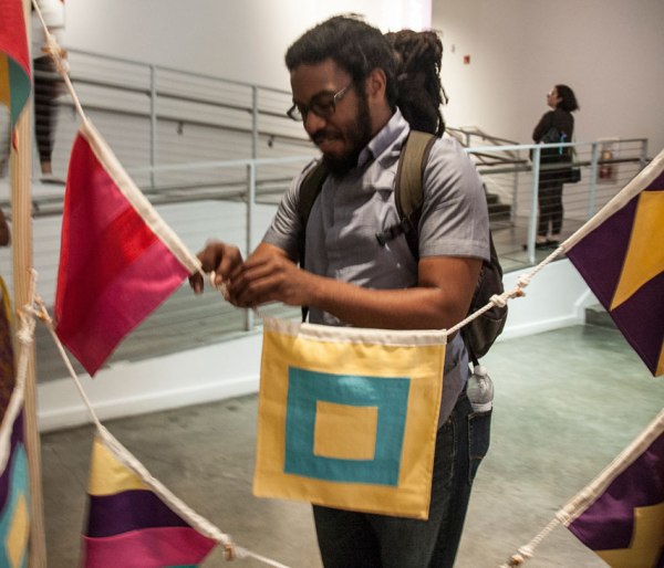 Participants are invited to string together the flags representing  their strengths. Connect the toggles to the loops.
