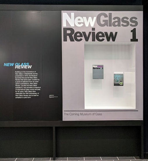 A case with "New Glass Review 1" in vinyl, displaying the first and most recent issues of New Glass Review.